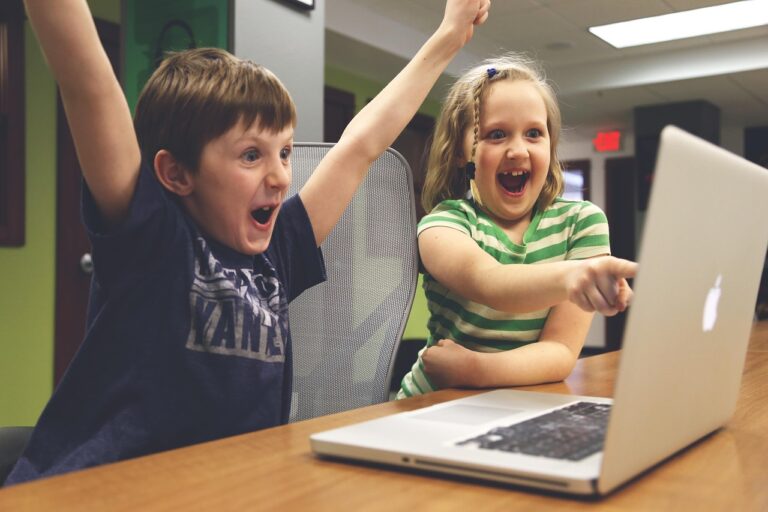 Happy children at a computer